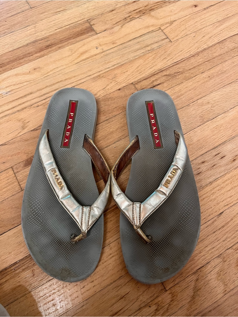 Prada Silver Metallic Thong Sandals with Red Logo Inset
